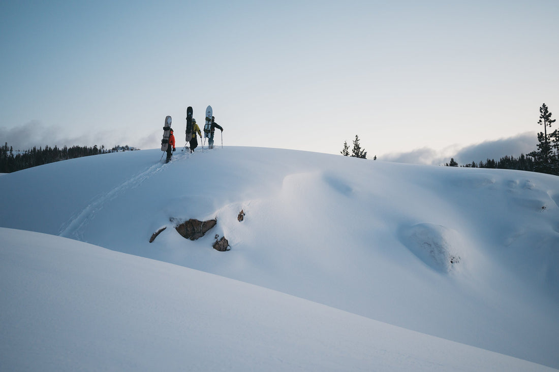 Jeremy, Cass and Mia Jones crest the ridge before sunrise.