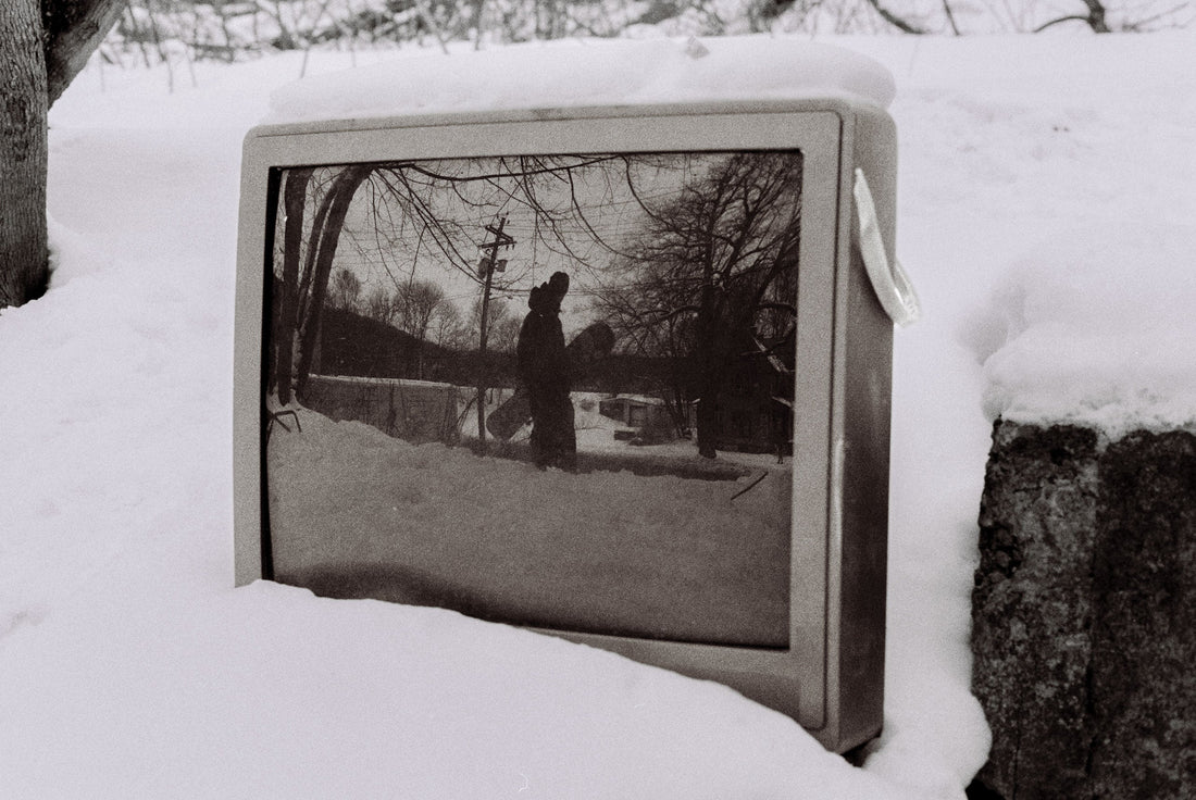 Finn Westbury was riding this spot in a sketchy neighborhood by an old house with a bunch of trash around it. I saw his reflection and asked him to stop for a second.