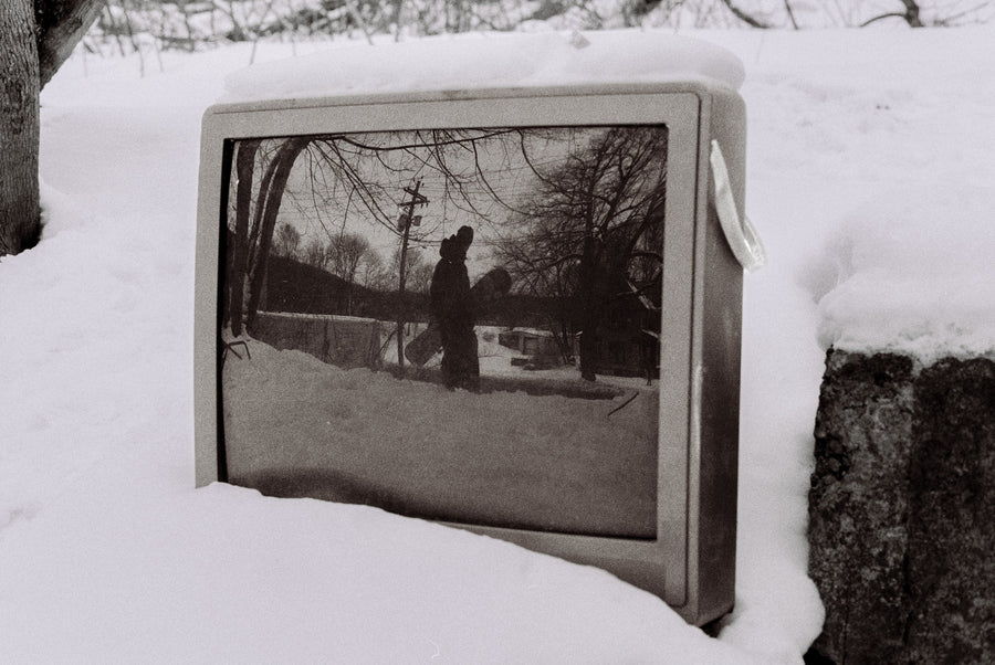 Finn Westbury was riding this spot in a sketchy neighborhood by an old house with a bunch of trash around it. I saw his reflection and asked him to stop for a second.