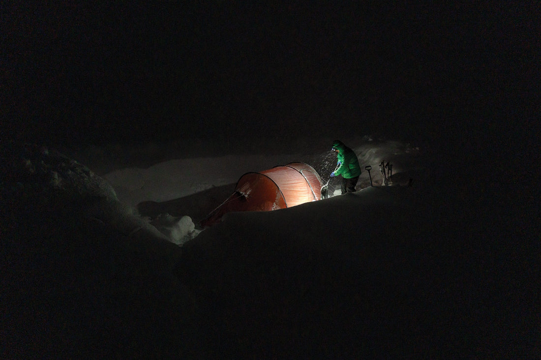 Maintaining camp required continuous digging. Ryland Bell on the late-night shift.