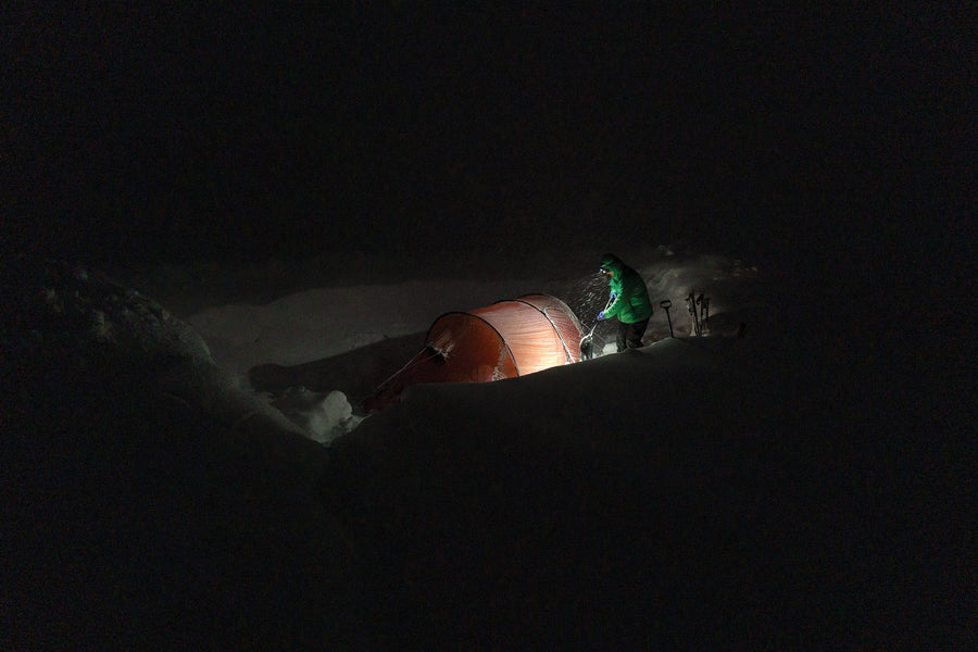 Maintaining camp required continuous digging. Ryland Bell on the late-night shift.