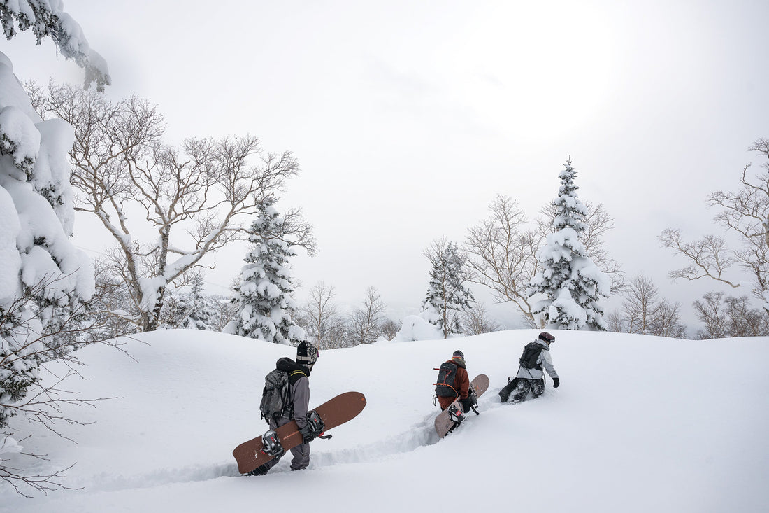 Robin Van Gyn leads Austen Sweetin and Nick Russell toward a classic tram-and-bootpack-accessed Asahidake tree run in Japan’s Kamikawa Subprefecture.