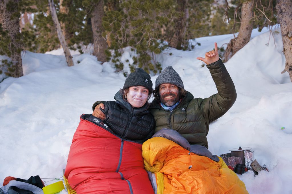 “Jeremy and Mia bundle up in their sleeping bags while preparing their favorite ramen recipe on the last night of the trip.” Photo: Cody Mathison